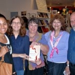 Cousin Marla Krull (center holding book) with members of her husband Hank Radoff's family